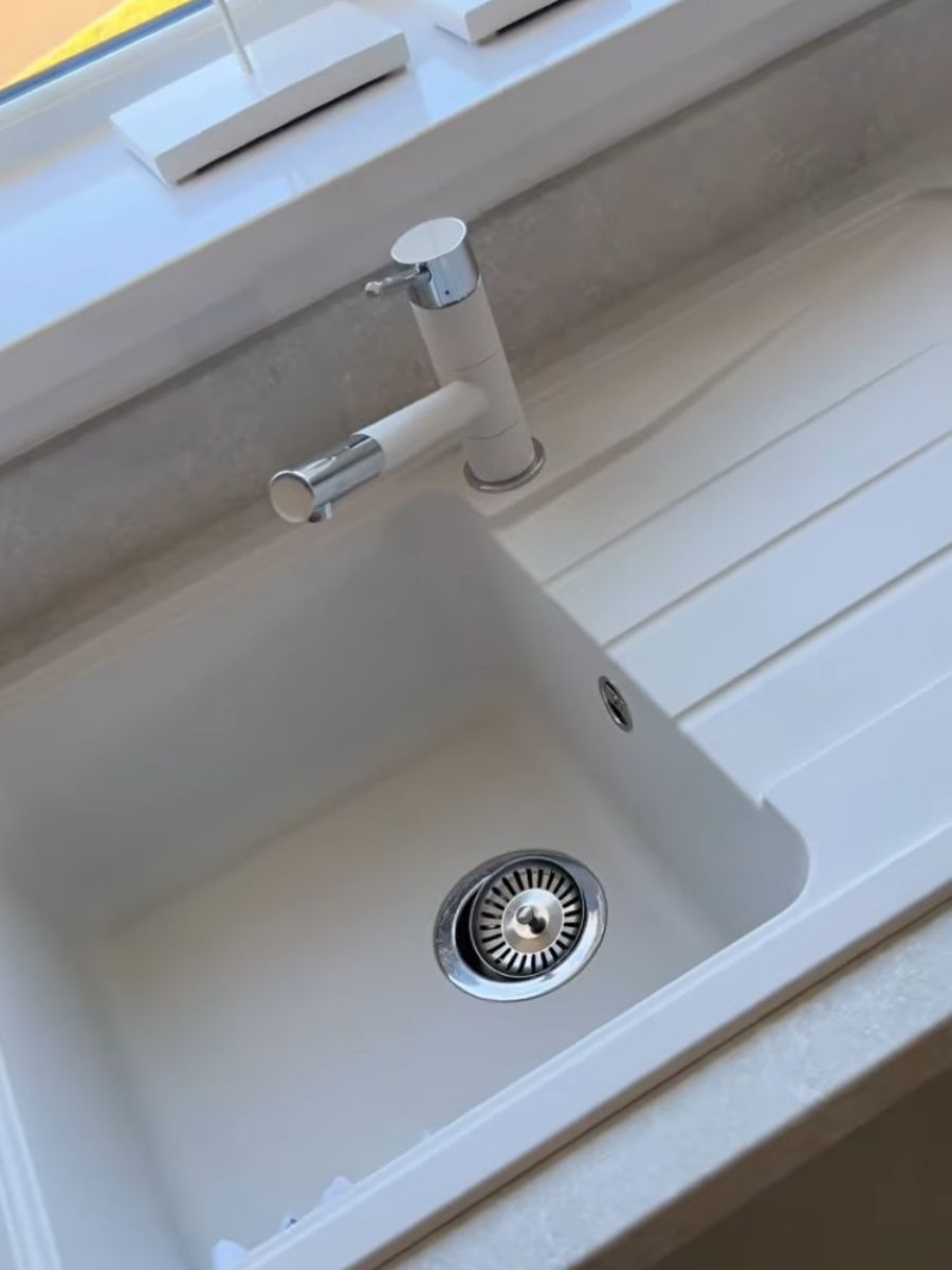 close up of white granite kitchen sink
